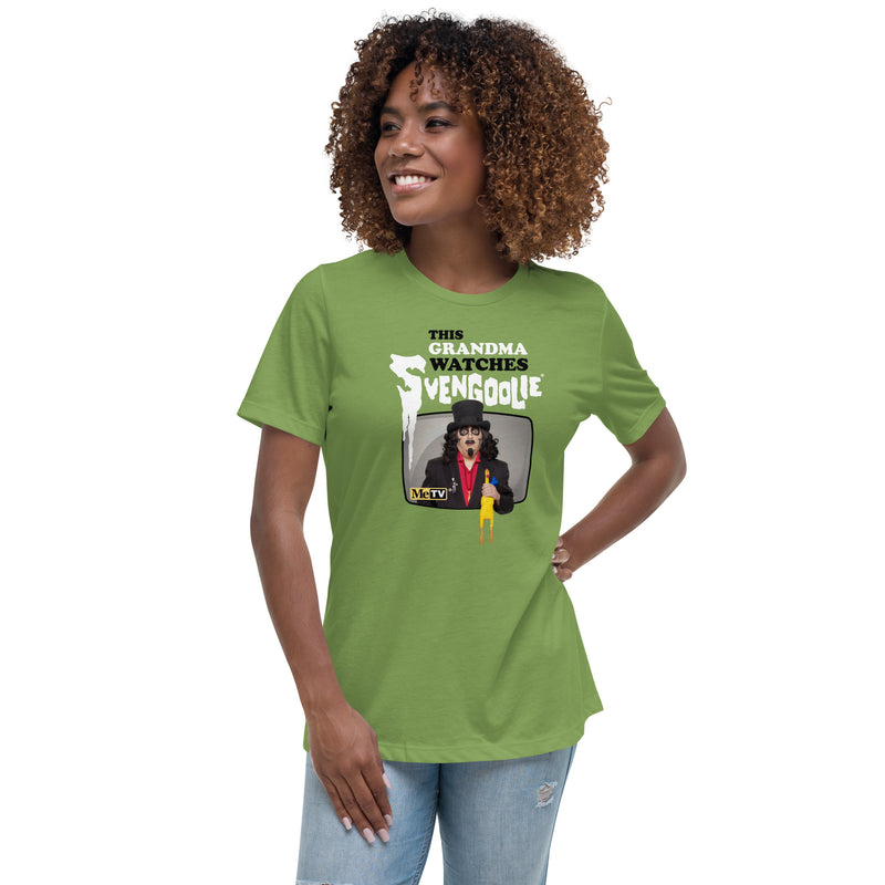 Model wearing green t-shirt featuring Svengoolie holding a rubber chicken with the text 'This Grandma Watches Svengoolie' in black and white above it.