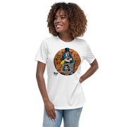 Model wearing White t-shirt featuring Svengoolie holding a rubber chicken, by a TV with Orange circle border. Svengoolie logo at lower left.