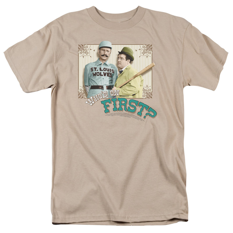 Tan crew-neck t-shirt with graphic of two men in vintage baseball attire, one in a St. Louis Wolves jersey, above the text "WHO'S ON FIRST?".