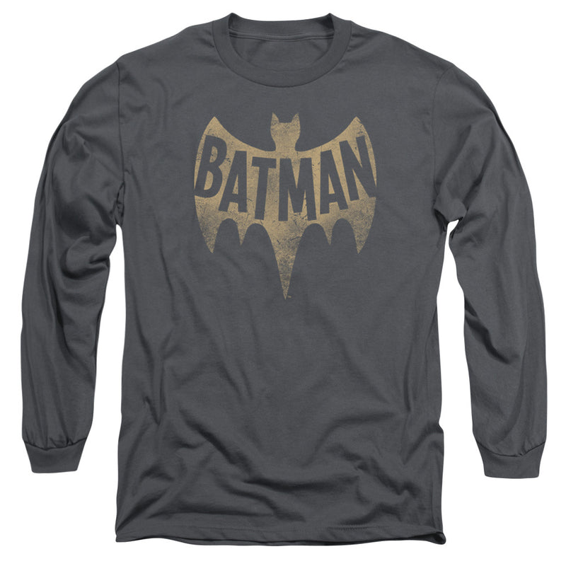 Charcoal gray long-sleeve t-shirt with a distressed tan Batman bat-symbol logo; the word "BATMAN" is printed in dark gray across the bat's wings.