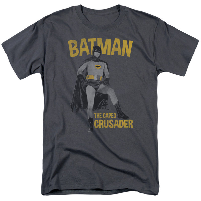 Charcoal gray t-shirt with gold text reading "BATMAN" above a photo of Batman in a costume, and "THE CAPED CRUSADER" below.