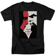 Black short-sleeved t-shirt featuring a two-tone profile poster design with the text 'THE EMISSARY' in red below it.
