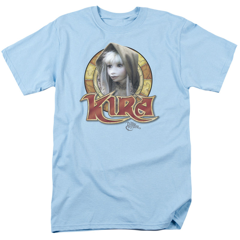 Light blue t-shirt with circular graphic of Kira, a pale puppet character in a hood, above red 'KIRA' logo text and small 'The Dark Crystal' text.