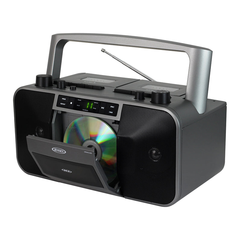 Gray and black Jensen portable stereo boombox with open CD door, silver carry handle, telescoping antenna, and front control buttons including PROG and REPEAT.
