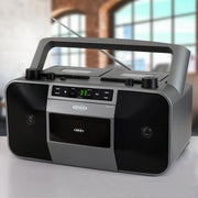 Gray Jensen portable boombox with CD player, dual cassette decks, AM/FM radio, carry handle, and telescoping antenna, with 'JENSEN' logo and 'CD' label on front.