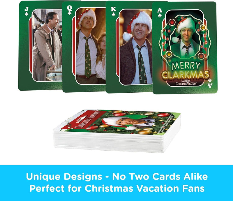Fanned jack, queen, king, and ace of clubs from the Christmas Vacation playing cards, with the ace reading 'MERRY CLARKMAS' in glowing green letters.