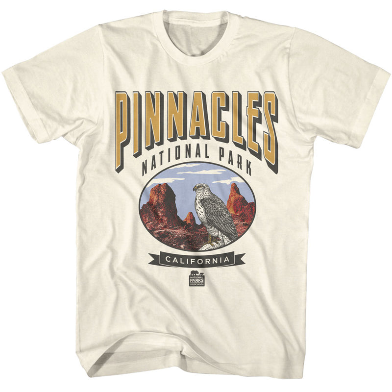 Cream short-sleeved t-shirt featuring a falcon in an oval of red rock pinnacles with the text 'PINNACLES' in gold.