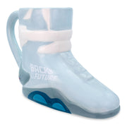 Light blue ceramic mug shaped like Marty McFly's Nike sneaker with white laces, teal sole, and 'BACK TO THE FUTURE' printed on the side.