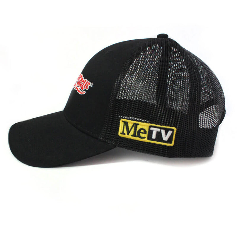 Black mesh-back snapback cap, side view, with red Svengoolie logo on the front panel and yellow MeTV patch on the side.