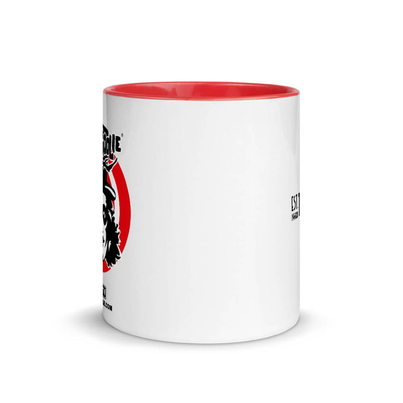 White ceramic mug with red inner rim and a black-and-red Svengoolie face logo in a red circle.
