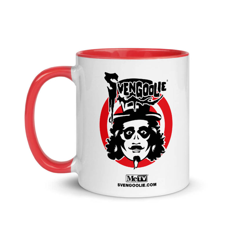White ceramic mug with red handle and interior, featuring black Svengoolie logo, character face on red circle, and text "MeTV" and "SVENGOOLIE.COM" below.
