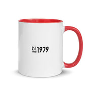 White ceramic mug with red interior and handle, featuring black text reading "EST. 1979" with "MeTV" logo beneath the year.