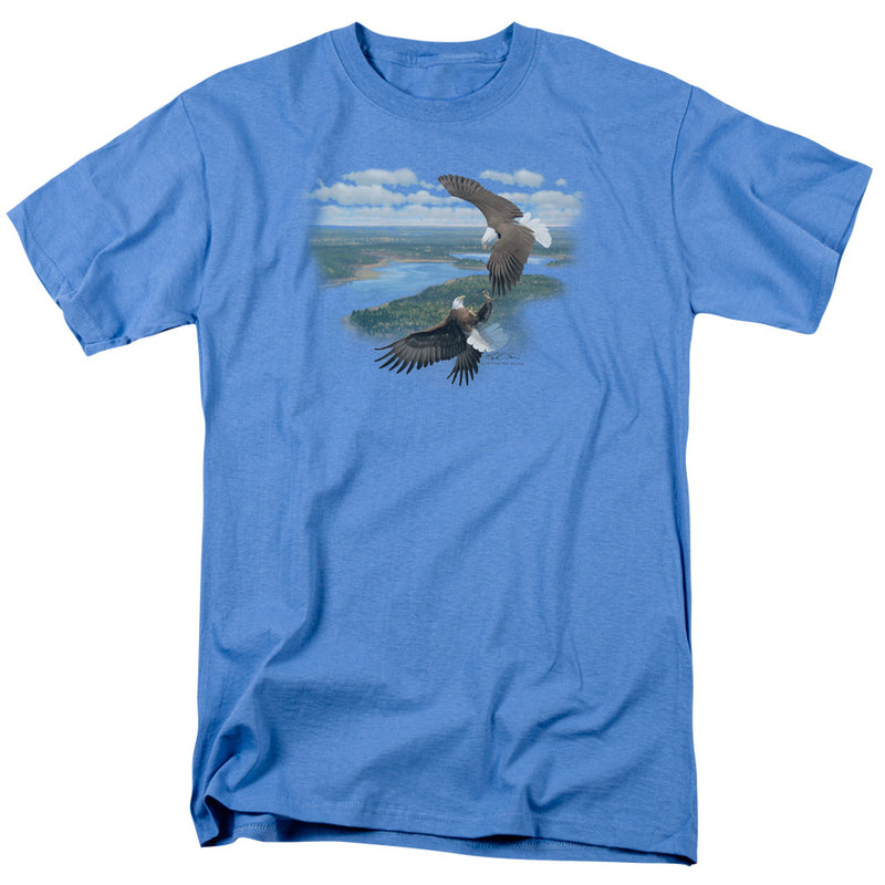 Light blue short-sleeve t-shirt with a printed scene of two bald eagles flying over a river and green forested landscape under a cloudy sky.