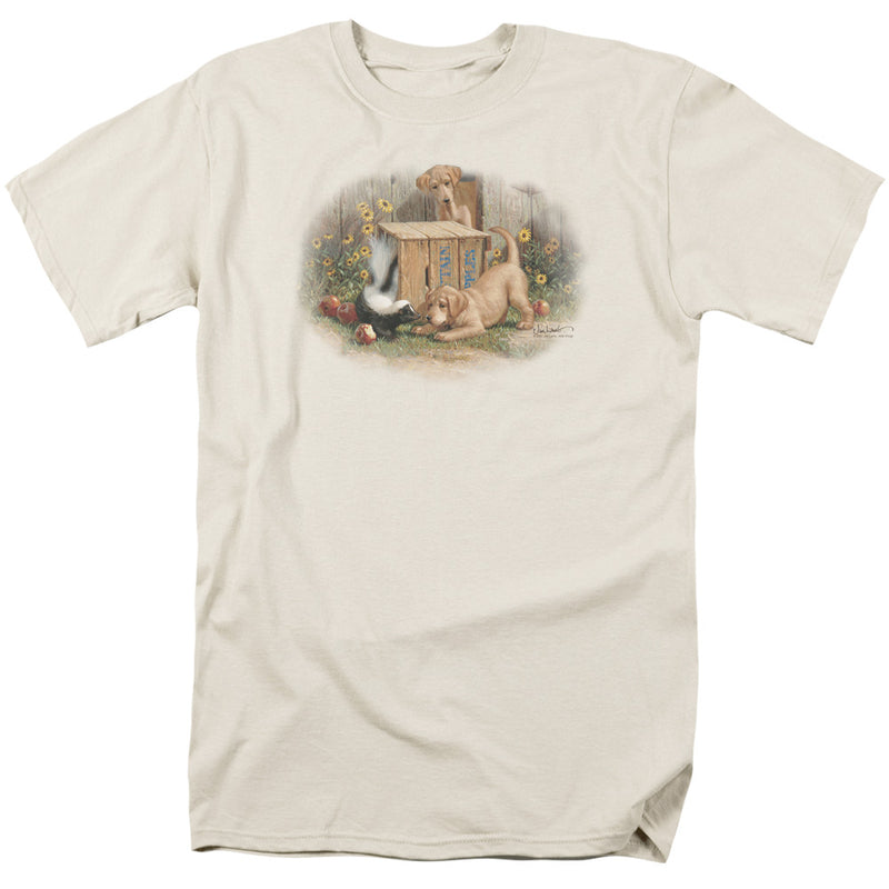 Cream short-sleeved t-shirt featuring two puppies and a skunk by a wooden crate, with sunflowers and apples in a garden scene.