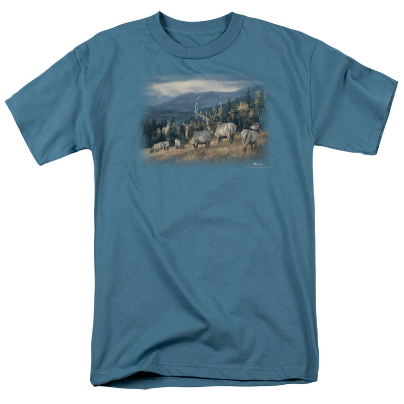 Slate blue crew-neck t-shirt with printed painting of a herd of elk in a golden meadow below pine-covered mountains
