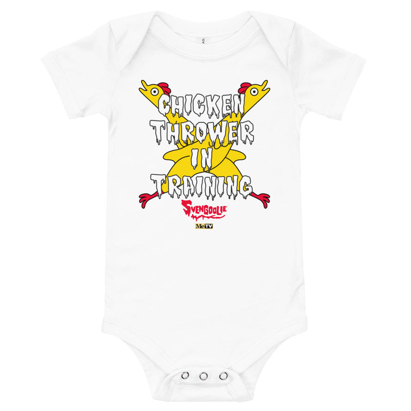 White baby onesie with yellow cartoon chickens crossed over the text "CHICKEN THROWER IN TRAINING" and a red "Svengoolie" logo.