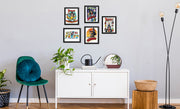 Five black-framed Svengoolie art prints hang in a grouping on a gray wall above a white cabinet in a room setting.