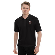 Model wearing Black polo shirt with small embroidered Svengoolie logo on left chest: "MeTV" logo below.