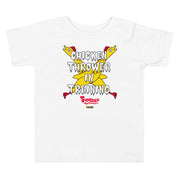 White toddler t-shirt with yellow cartoon chickens crossed over the text "CHICKEN THROWER IN TRAINING" and a red "Svengoolie" logo.