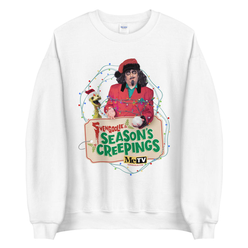 White Crewneck sweatshirt with Svengoolie in red suit holding a chicken, string lights, and "Season's Creepings" text plus MeTV logo.