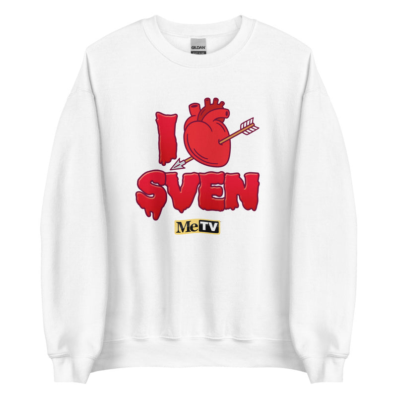 White crewneck sweatshirt with red dripping graphic reading "I" followed by a red anatomical heart pierced by an arrow, then "SVEN" and a small "MeTV" logo below.
