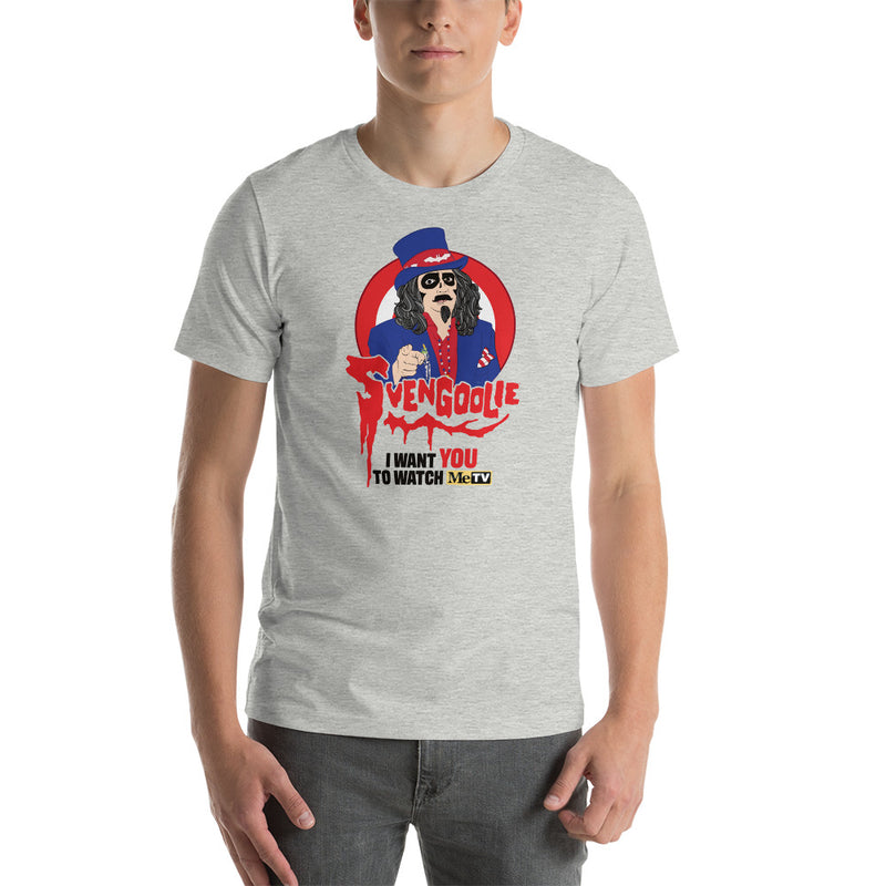 Gray crew neck t-shirt with red, blue, and black graphic of Svengoolie in top hat and blue jacket, text reads "SVENGOOLIE I WANT YOU TO WATCH MeTV".