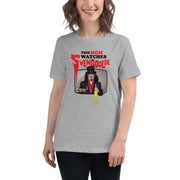 Model wearing gray t-shirt featuring Svengoolie holding a rubber chicken with the text 'This Mom Watches Svengoolie' in black and red above it.