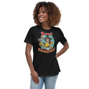 Black women's relaxed t-shirt with cartoon Svengoolie in top hat on a flaming car shaped like a chicken, text 'Svengoolie's Burnin' Rubber Chicken!'.