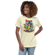 Pale yellow women's relaxed tee with cartoon Svengoolie in top hat on a flaming car shaped like a chicken, text 'Svengoolie's Burnin' Rubber Chicken!'.